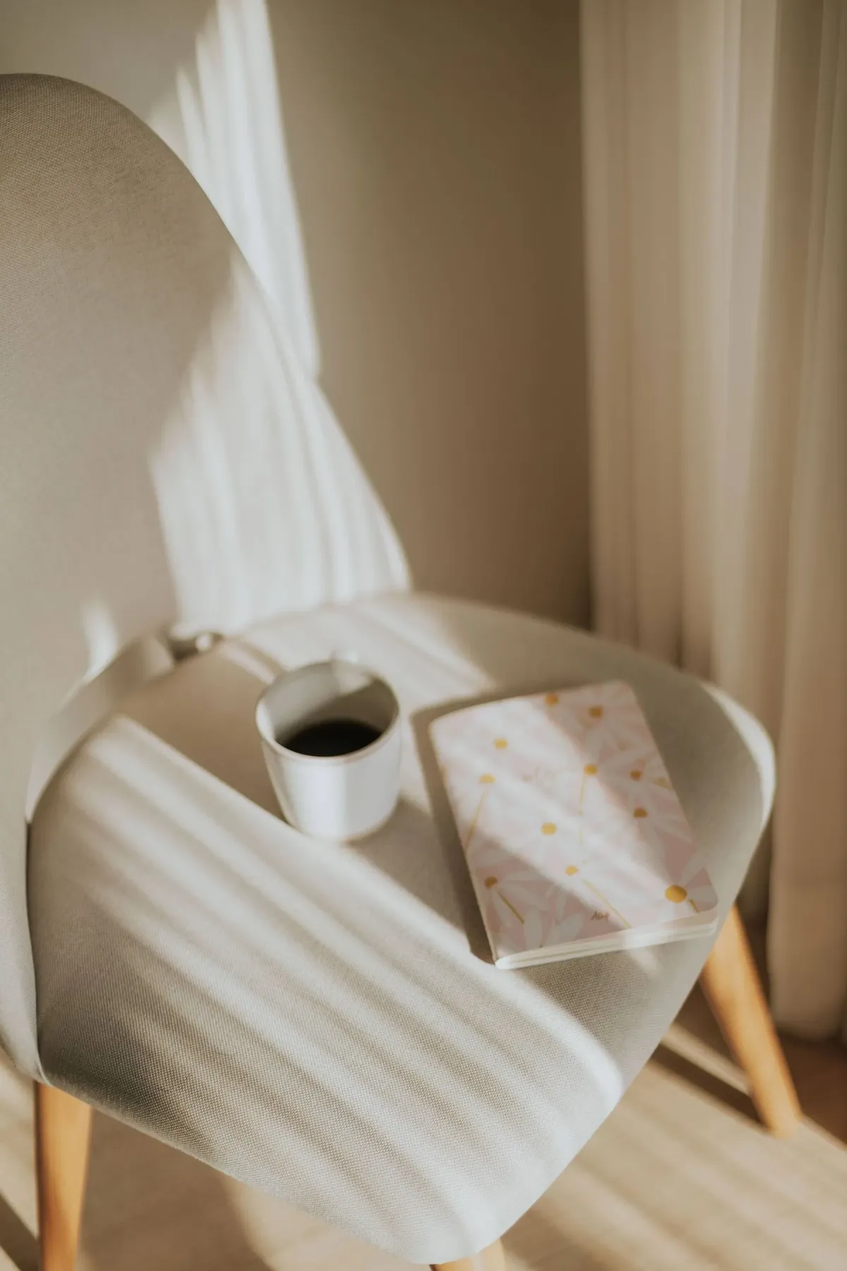 Coffee and an open journal in soft morning light